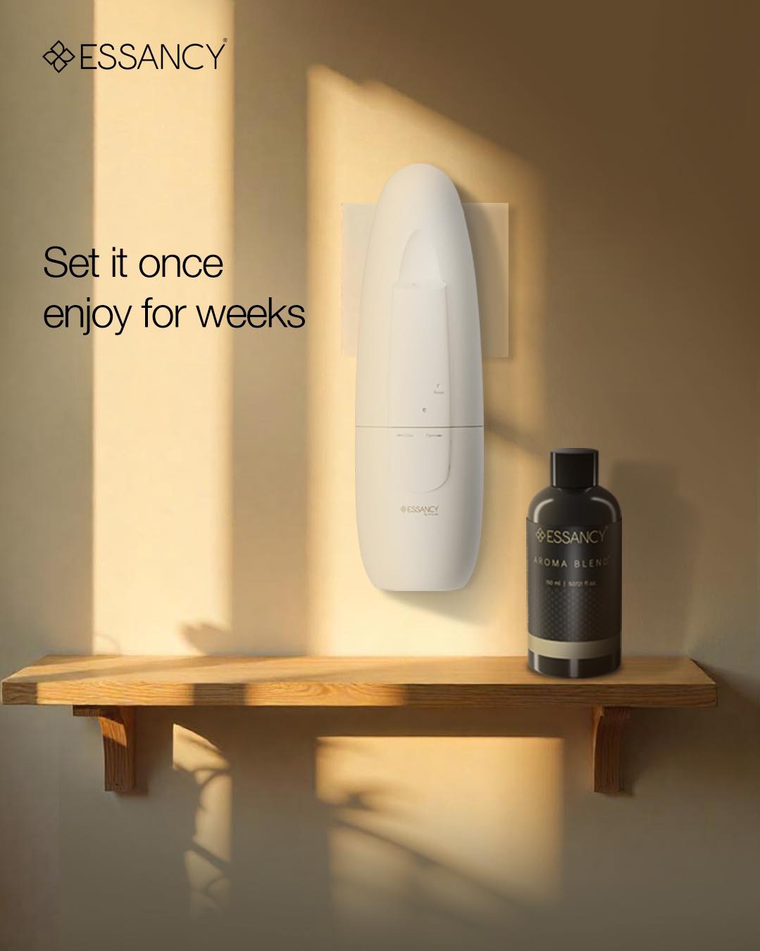 Essancy device and bottle on a wooden shelf with warm lighting